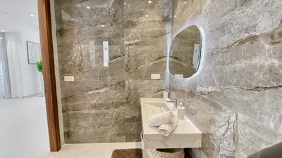 a bathroom with a sink and a mirror at Villa de Rêve sans vis-à-vis à Marrakech in Marrakech