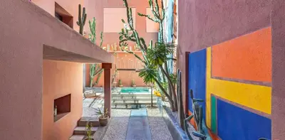 a hallway of a building with a colorful wall at Villa OTIA in Marrakech