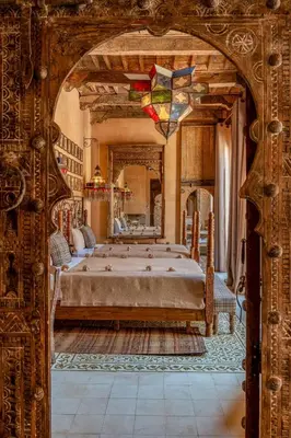 a bedroom with a large bed in a room at Riad Royal Koubba in Marrakech