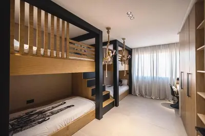 a bedroom with two bunk beds in a room at Majorelle Garden Gem in Marrakech