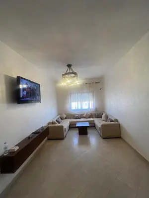 a living room with two couches and a tv at Appartement Marrakech in Marrakech