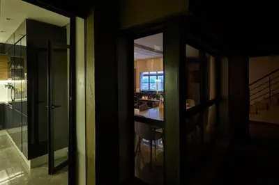 a kitchen with a table and a glass door at luxueux duplex avec piscine privée in Marrakech