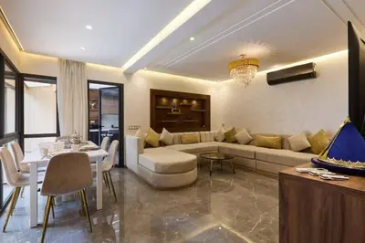 a living room with a couch and a table at Luxurious duplex with a private pool in Marrakech