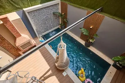 an overhead view of a swimming pool with a hammock at Luxurious duplex with a private pool in Marrakech