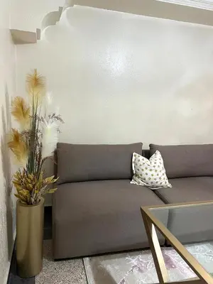 a living room with a couch and a table at Apartment in the center of Marrakesh in Marrakech
