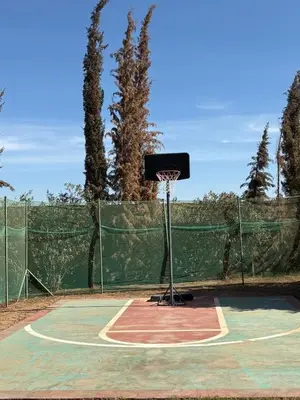 a basketball hoop on a tennis court at Villa Sofia And Spa in Marrakech