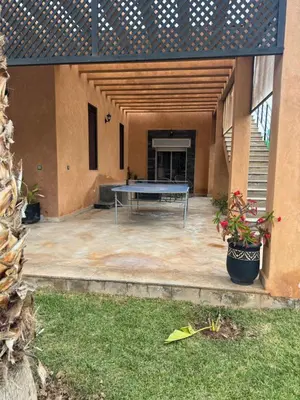 a patio with a ping pong table in a building at Villa Sofia And Spa in Marrakech