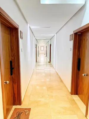 an empty hallway with two doors and a tile floor at Marrakech apartment with pool - Pearl Garden in Marrakech