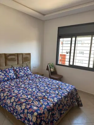 a bedroom with a bed and a window at Marrakech Nice Apartment- Central Marrakech in Marrakech