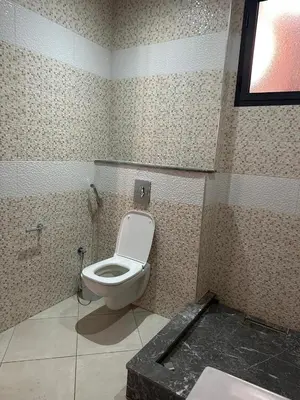 a bathroom with a toilet in a room at Marrakech Nice Apartment- Central Marrakech in Marrakech