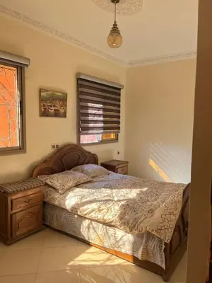 a bedroom with a bed and a window at Modern apartment, 10 minutes from the airport in Marrakech
