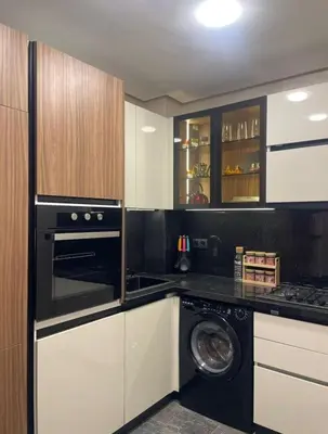 a kitchen with a washer and a washing machine at Brg Immo in Marrakech