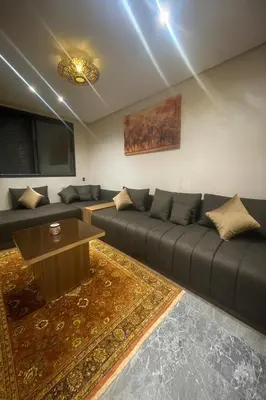 a living room with a couch and a table at Brg Immo in Marrakech