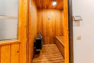 a hallway with a wooden floor and a wooden door at MVIEW Villas in Marrakech