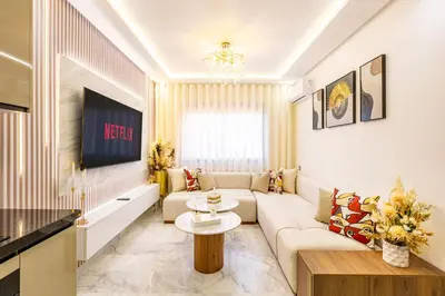 a living room with a couch and a table at Guéliz Centre-Appartement Chic près Carré Eden in Marrakech