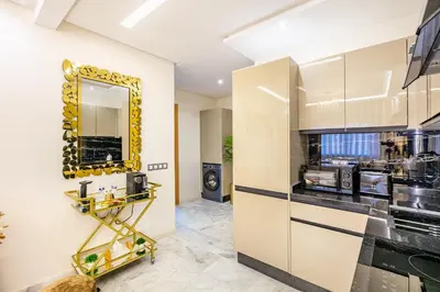 a kitchen with a mirror on the wall at Guéliz Centre-Appartement Chic près Carré Eden in Marrakech