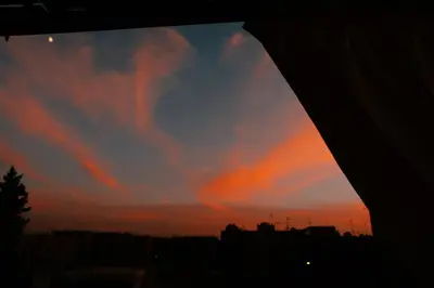 a view of a sunset from a window at Beldi-Chic & Moroccan Sweetness in Marrakech