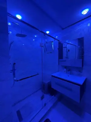 a bathroom with a glass shower and a sink at Comfort and charm 10 min from Guéliz in Marrakech