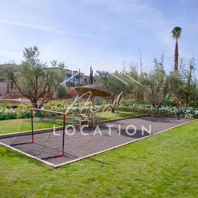 a park with a swing set and a playground at Villa Dar M in Marrakech