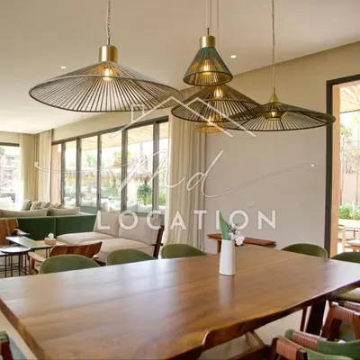 a dining room with a table and chairs at Villa Dar M in Marrakech