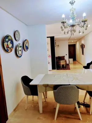 a dining room with a table and some plates on the wall at Luxury Stay Nour Prestige Residence, Gueliz in Marrakech