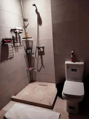 a bathroom with a shower and a toilet in it at Luxury Stay Nour Prestige Residence, Gueliz in Marrakech