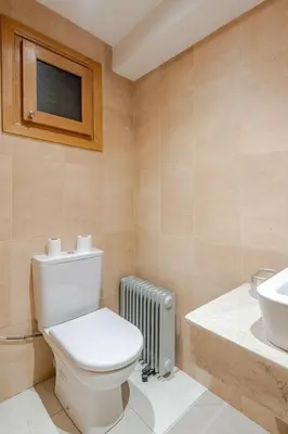 a bathroom with a toilet and a sink at Prestige Hivernage centr de marrakech in Marrakech