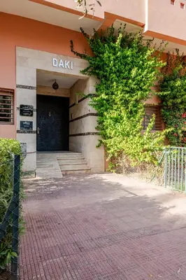 a front door of a building with a brick walkway at Prestige Hivernage centr de marrakech in Marrakech