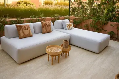 a white couch with pillows and a table at Mounir Hamari in Marrakech
