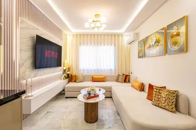 a living room with a couch and a table at Gueliz Chic stay next to Carré Eden in Marrakech