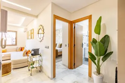 a living room with a couch and a table at Gueliz Chic stay next to Carré Eden in Marrakech