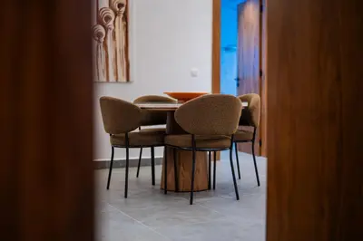a dining room table and chairs in a room at Modern Moroccan Apartment in Gueliz with Terrace in Marrakech