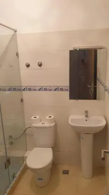 a bathroom with a toilet and a sink at Appartement 2 chambres meublé Marrakech in Marrakech