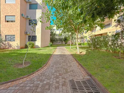 a brick path in front of a building at charming and cozy studio with swimming pool in Marrakech