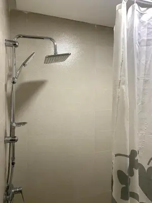 a shower in a bathroom with a shower curtain at Omar Hachoum in Marrakech