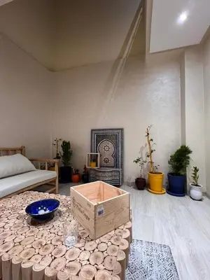 a room with a bed and a box on a table at Omar Hachoum in Marrakech