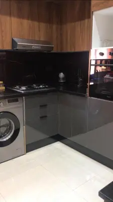 a kitchen with a stove and a washing machine at Welcome to your peaceful getaway in Marrakech! in Marrakech