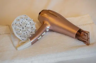 a hair dryer sitting on top of a towel at Le Nahla - Centre - 4 Prs - Terrasse in Marrakech