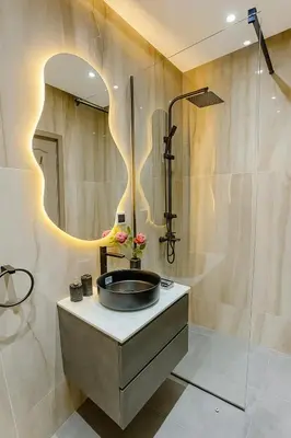 a bathroom with a sink and a mirror at Calme & Confort Mabroka - 2 chambre in Marrakech