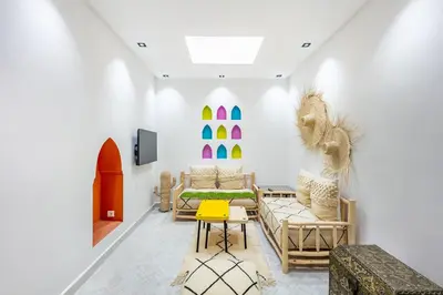 a living room with a couch and a table at Casa Coloré terrace and bohemian charm in Marrakech