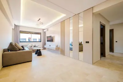 a living room with a couch and a table at Modern 2 bedroom apartment Marrakech in Marrakech