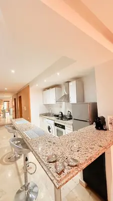 a kitchen with a marble counter top in a room at Chic Stay in Gueliz 1 in Marrakech