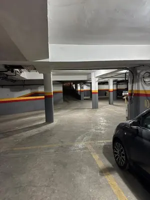 a parking garage with a car parked under a plane at Chic Stay in Gueliz 1 in Marrakech