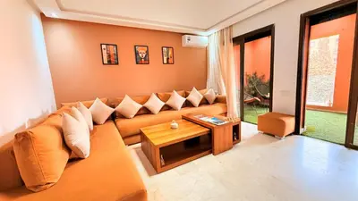 a living room with a couch and a table at Chic Stay in Gueliz 1 in Marrakech