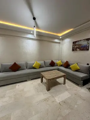 a living room with a couch and a coffee table at 3wina immobilier in Marrakech