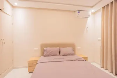 a bedroom with a bed in a room at Cosy & Modern Apartment Near Jardin Majorelle, Marrakech in Marrakech