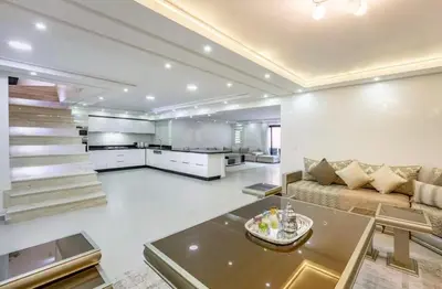 a large living room with a couch and a table at Luxury 4-ROM Villa with private Heated pool in Akenza ,free Airport transport service in El Rhechat