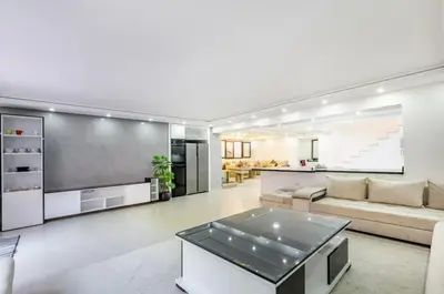 a living room with a couch and a table at Luxury 4-ROM Villa with private Heated pool in Akenza ,free Airport transport service in El Rhechat