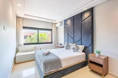 a bedroom with a large bed and a window at Luxury 4-ROM Villa with private Heated pool in Akenza ,free Airport transport service in El Rhechat