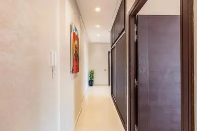 a hallway with a door and a potted plant at Luxury 4-ROM Villa with private Heated pool in Akenza ,free Airport transport service in El Rhechat